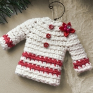 Sweater ornament in natural white with charming red accents