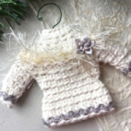 Sweater ornament in natural white with metallic silver trim