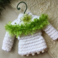 Sweater ornament in white with green trim and flower
